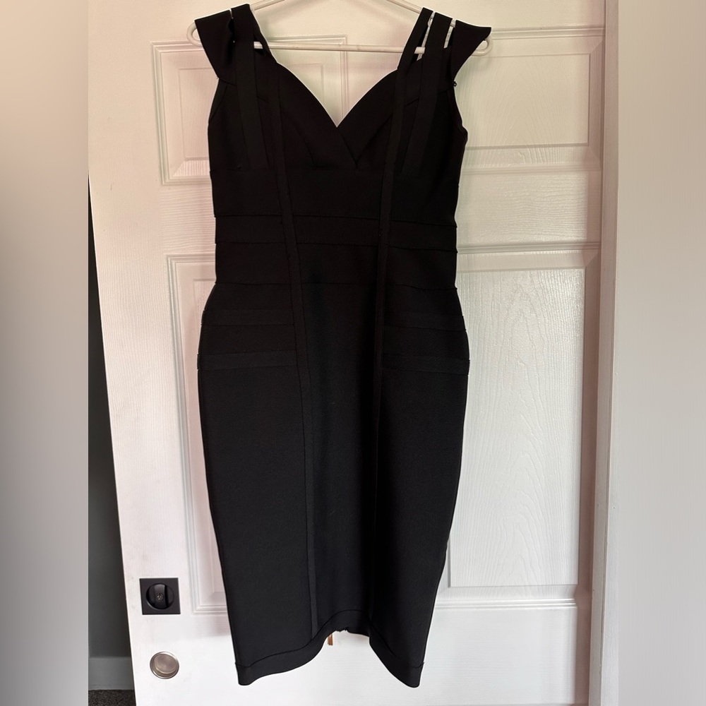 Never worn knee length black dress. Size L.  Back Zipper